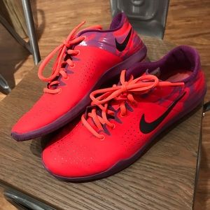 Red Nike tennis shoes